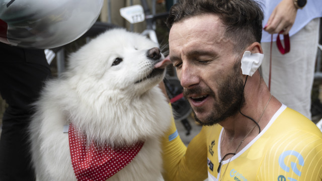 Adam Yates from Great Britain of UAE Team Emirates celebrates with dog Zoe after winning the Tour de Suisse after the eighth and final stage, a 15.7km Indovidual Time Trial 26 08 2024